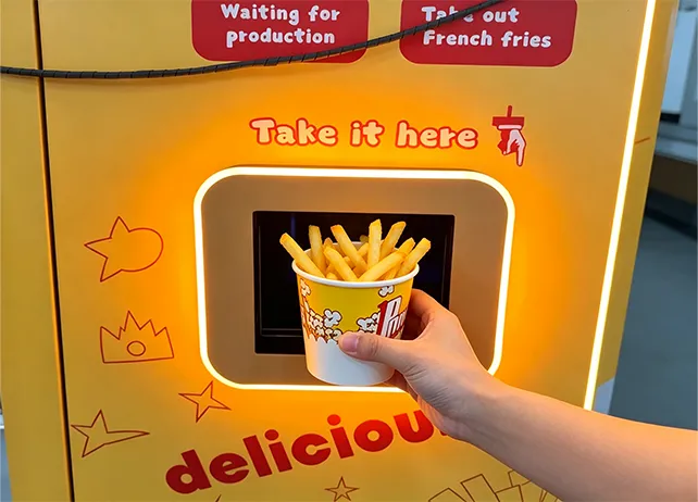 Customer pickup and finished hot French fries
