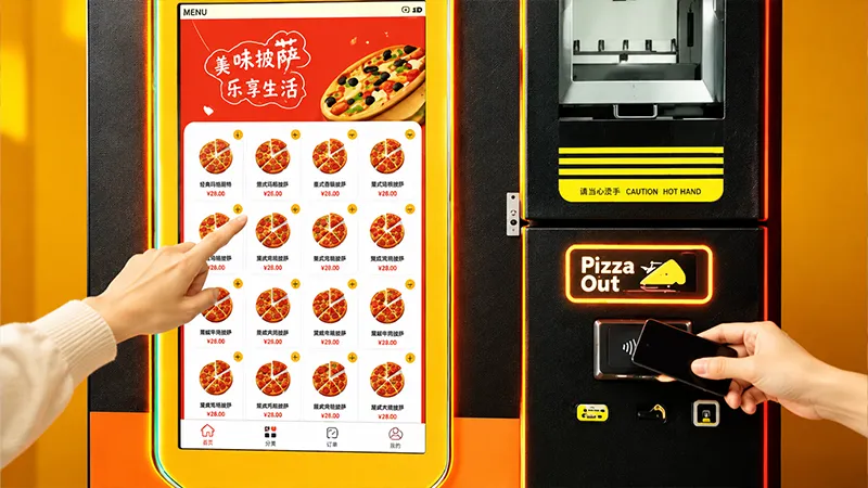 Select flavor and pay on pizza vending machine touch screen